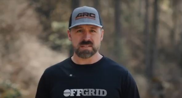 Two trainees debriefing after a session, relaxed posture and natural smiles