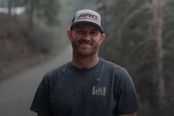 Instructor demonstrating a live-fire safety brief to a small group
