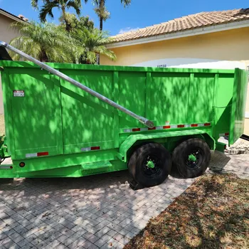 Hydraulic dump trailer for job site cleanup and construction debris removal in South Florida