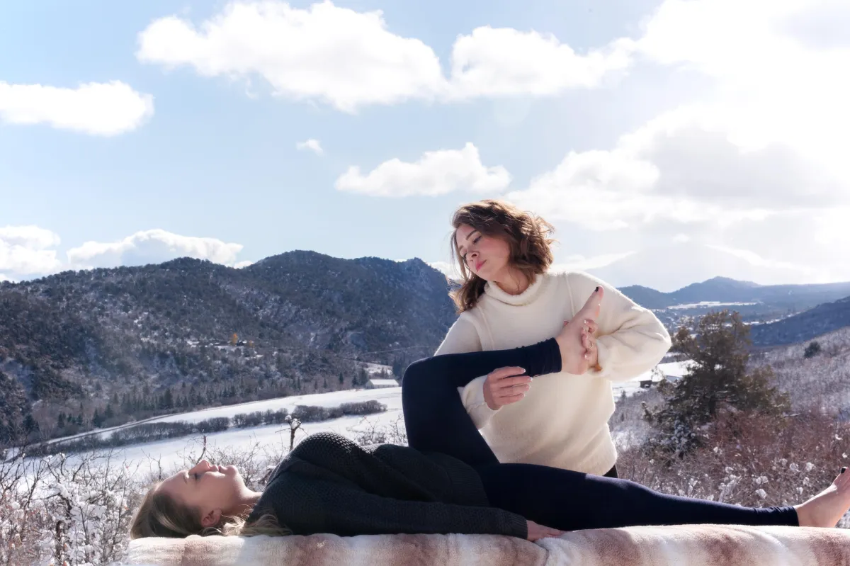 a person walking along a beach next to the ocean