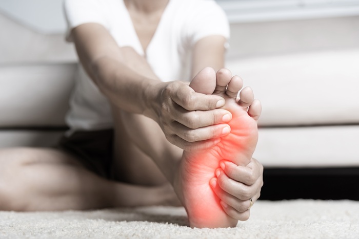 Women feet with Plantar Fasciitis