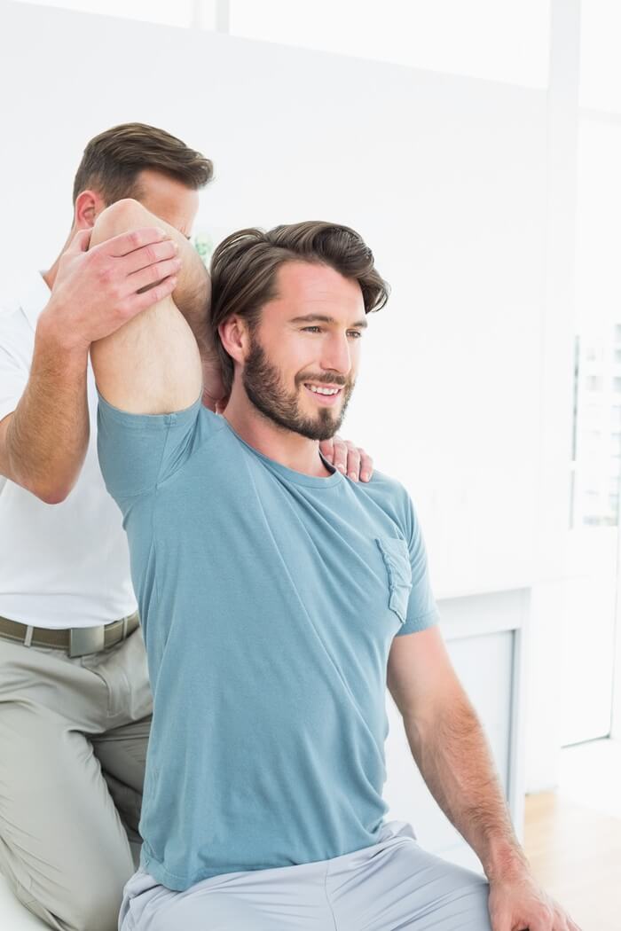 Chiropractor Doing Back Adjustments to a Patient in Tucson AZ