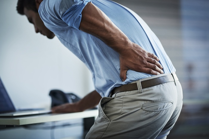 Office Man Suffering from Back Pain at Work