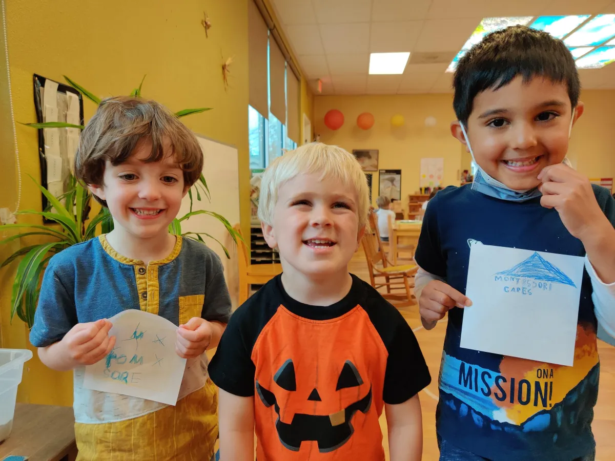 woman wearing blue denim jacket holding book