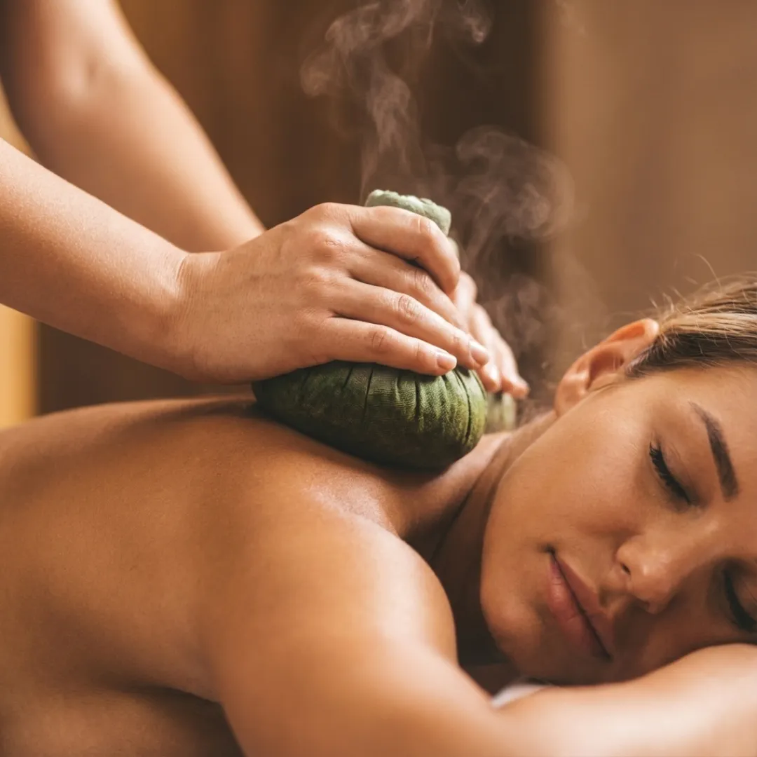 Thai Herbal Compress Massage in Werribee using warm herbal compresses to ease pain and relax muscles.