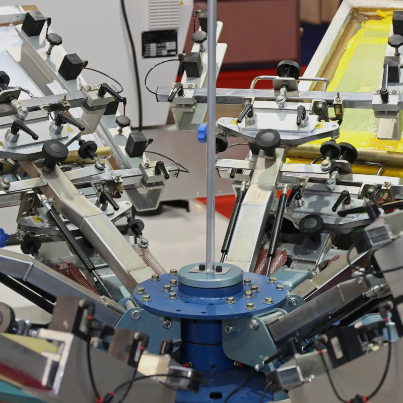 Screen printing equipment producing custom apparel for schools and businesses.
