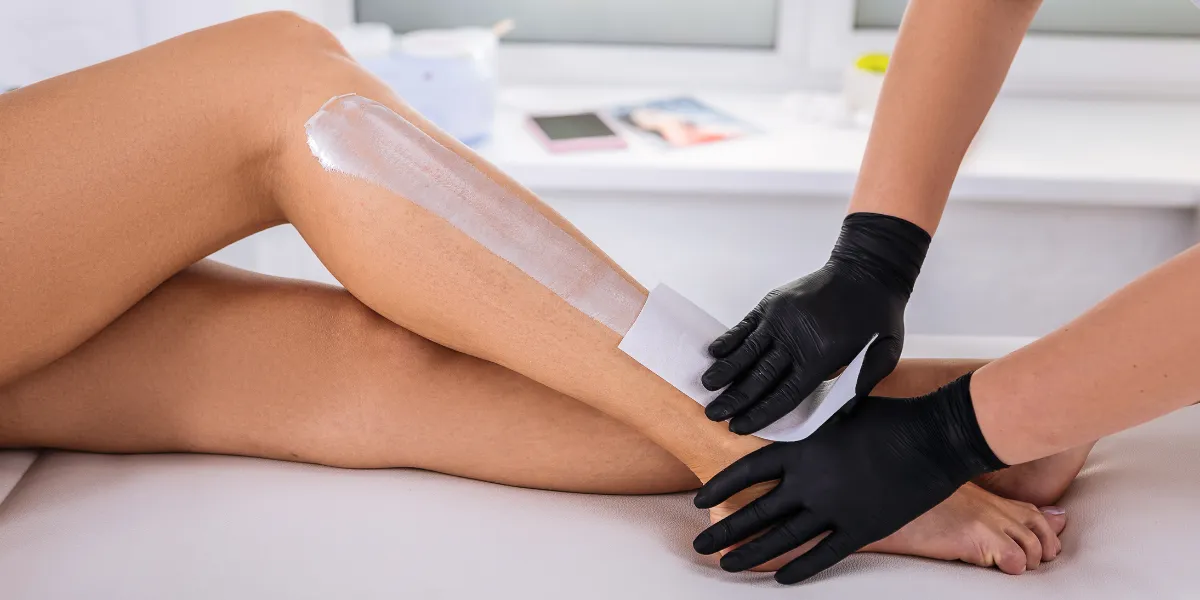 A leg being waxed