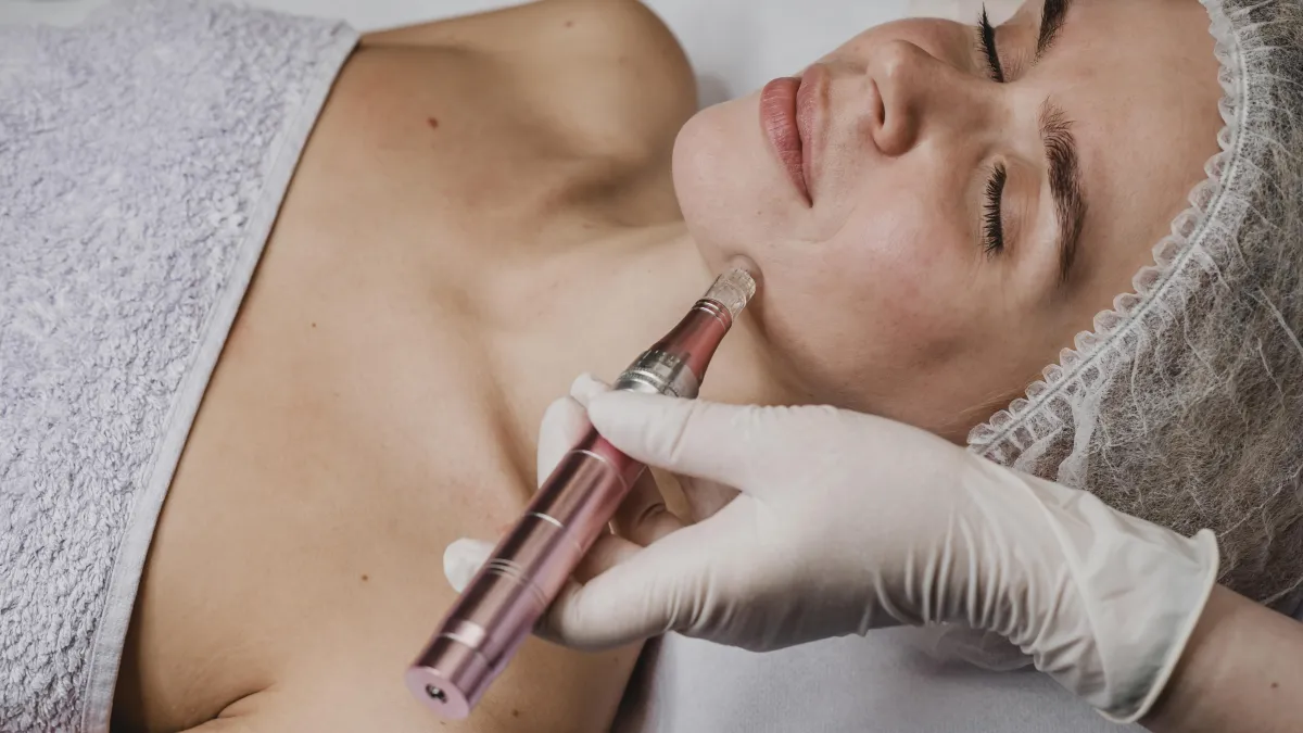 Young Woman laying down having skin rejuvenation treatment