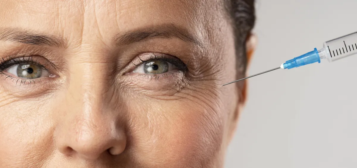 Woman with an injection needle pointing towards her eye smile wrinkles