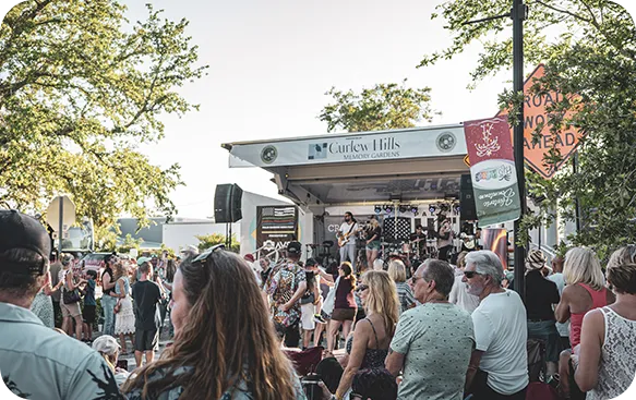 Community event with attendees gathered outdoors at a veteran-focused event