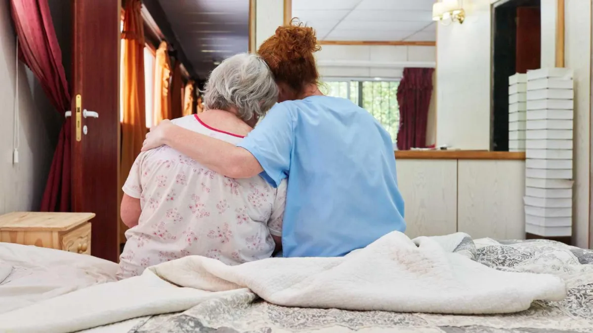 Sunflower caregiver assisting a hospice care client