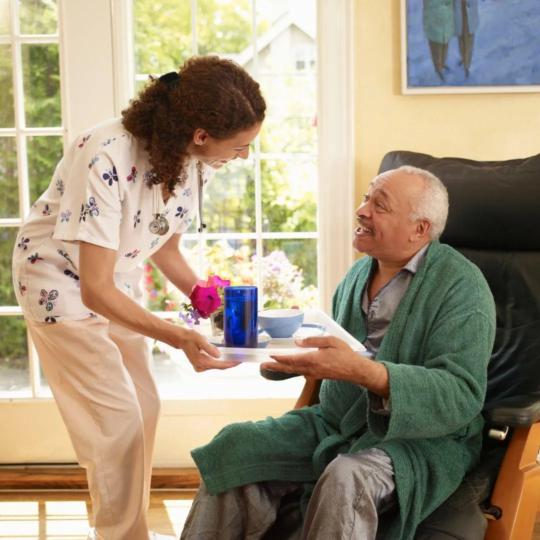 Home Care caregiver providing nutrition to a home care client in Philadelphia