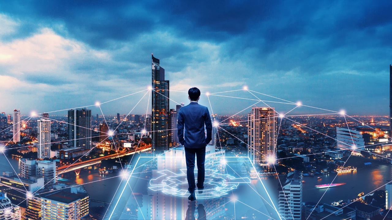 Business man with situational awareness standing on a platform overlooking the city