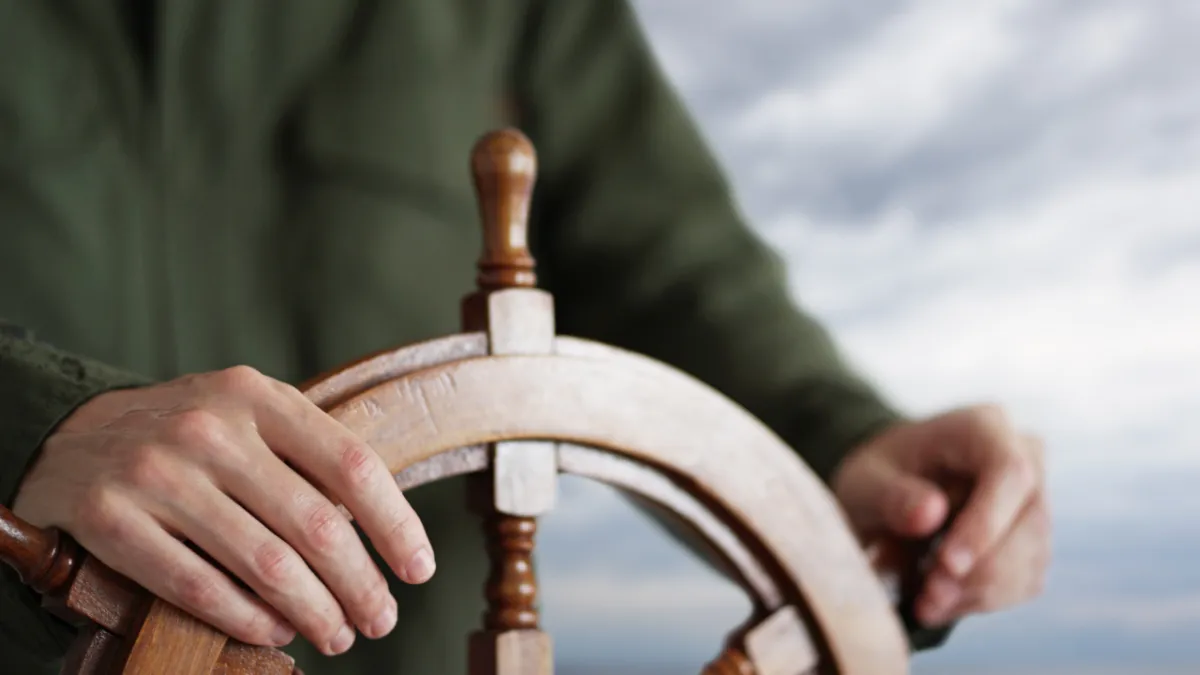 Captain steering the ship