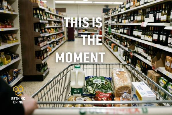 first person view pushing shopping trolley into alcohol aisle showing real life decision moment