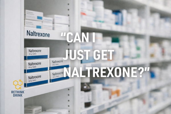 Pharmacy shelves in a UK dispensary with a section labelled naltrexone among other prescription medications