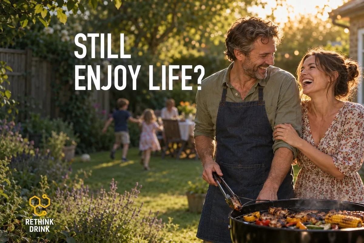 A couple laughing at a garden barbecue while children play, asking whether you can still enjoy life on naltrexone