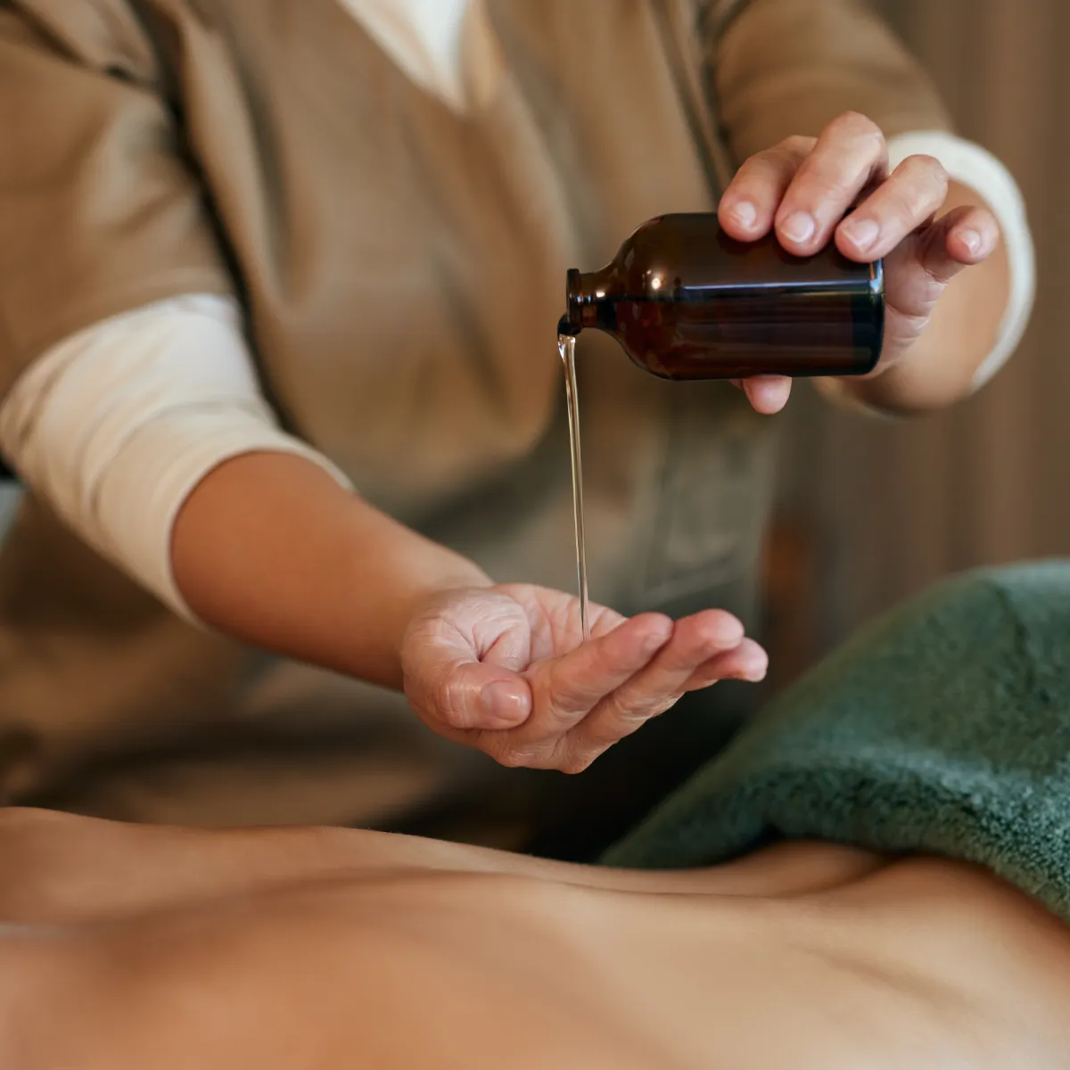 Hand reflexology therapy with therapist applying pressure to palm reflex points for relaxation, circulation, and holistic wellness