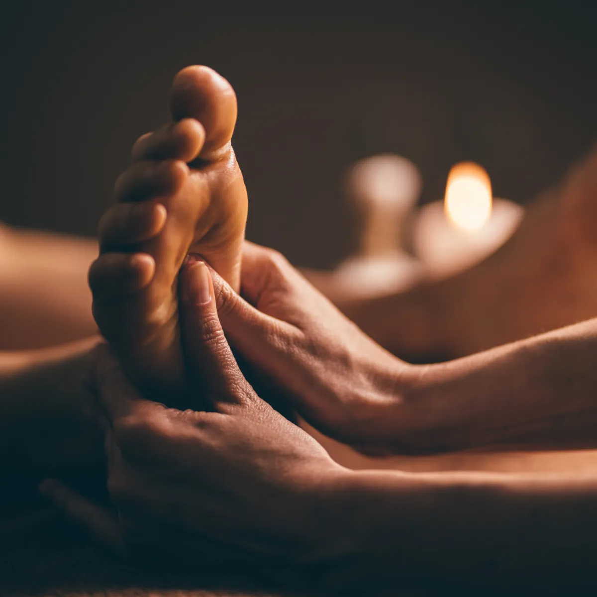Foot massage therapy icon showing pressure points used in reflexology and therapeutic massage for relaxation and stress relief