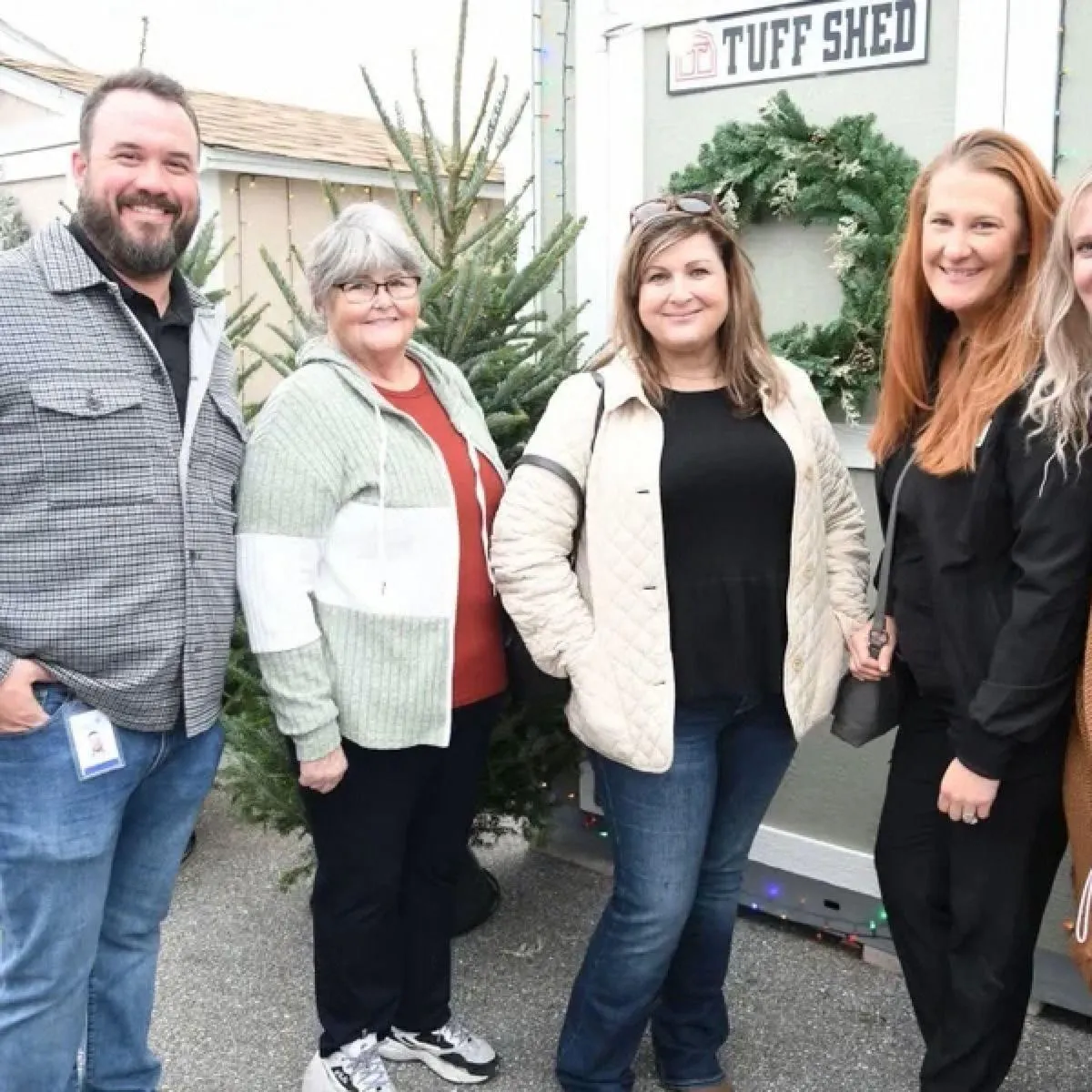 Four adults at a Rockin' It Local business meetup.