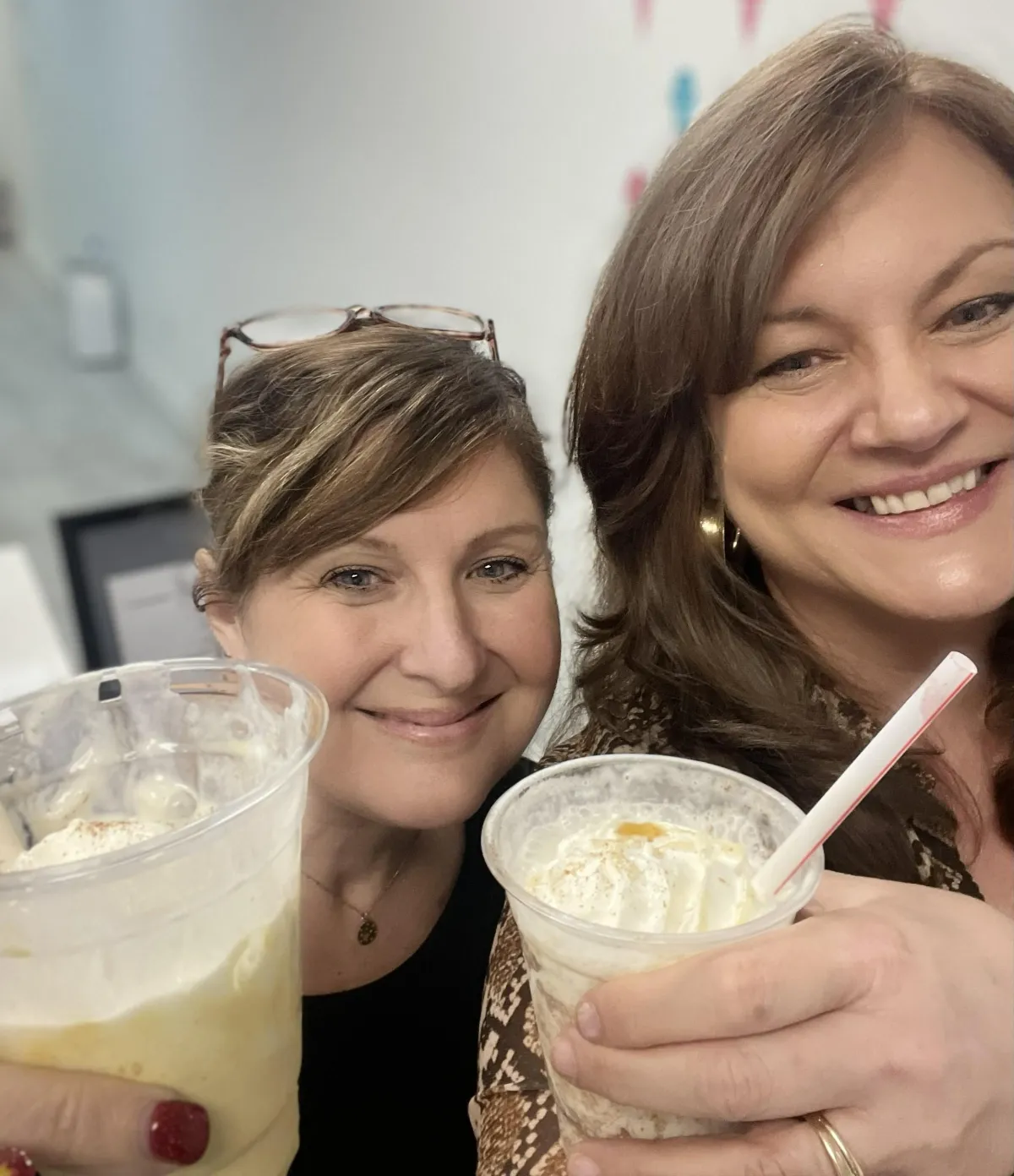 Two omen getting ice cream at a vendor event.
