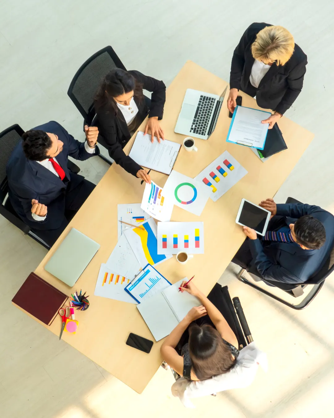 Team strategy session analyzing business operations with a Fractional COO