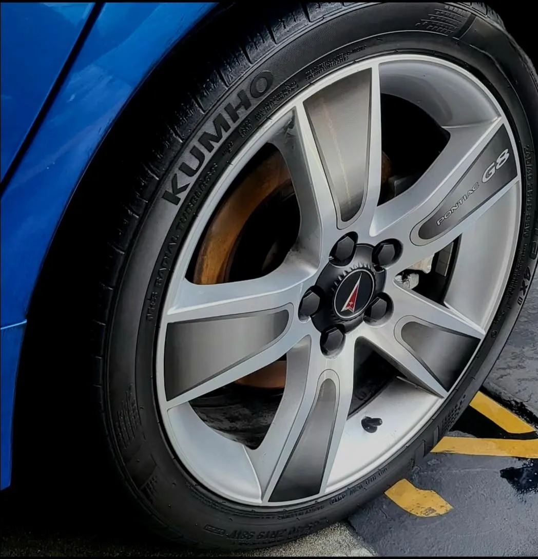 A clean shinny rim and tire after a wheel restoration and wheel cleaning done in are exterior detailing package.