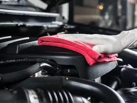 Close-up of a professionally detailed car engine with polished components, showcasing expert mobile detailing service in La Habra, Ca for improved performance and visual appeal.