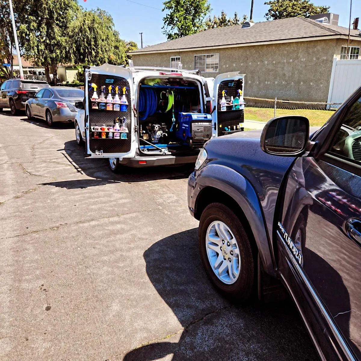 Mobile car wash van detailing a commercial truck on-site in La Habra, CA — eco-friendly fleet cleaning service.