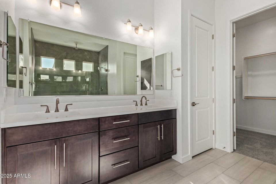 Bathroom with dark brown cabinets