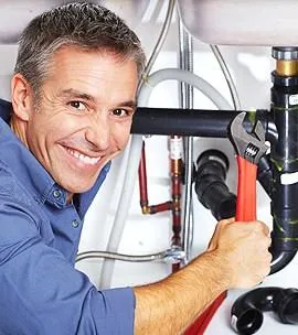 Plumber repairing a leaking sink in Bluffdale, UT.