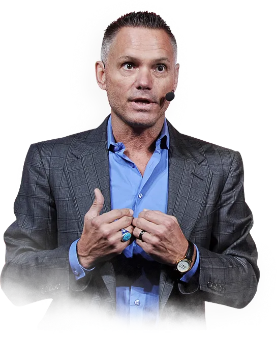 Kevin Harrington on a stage setting with audience