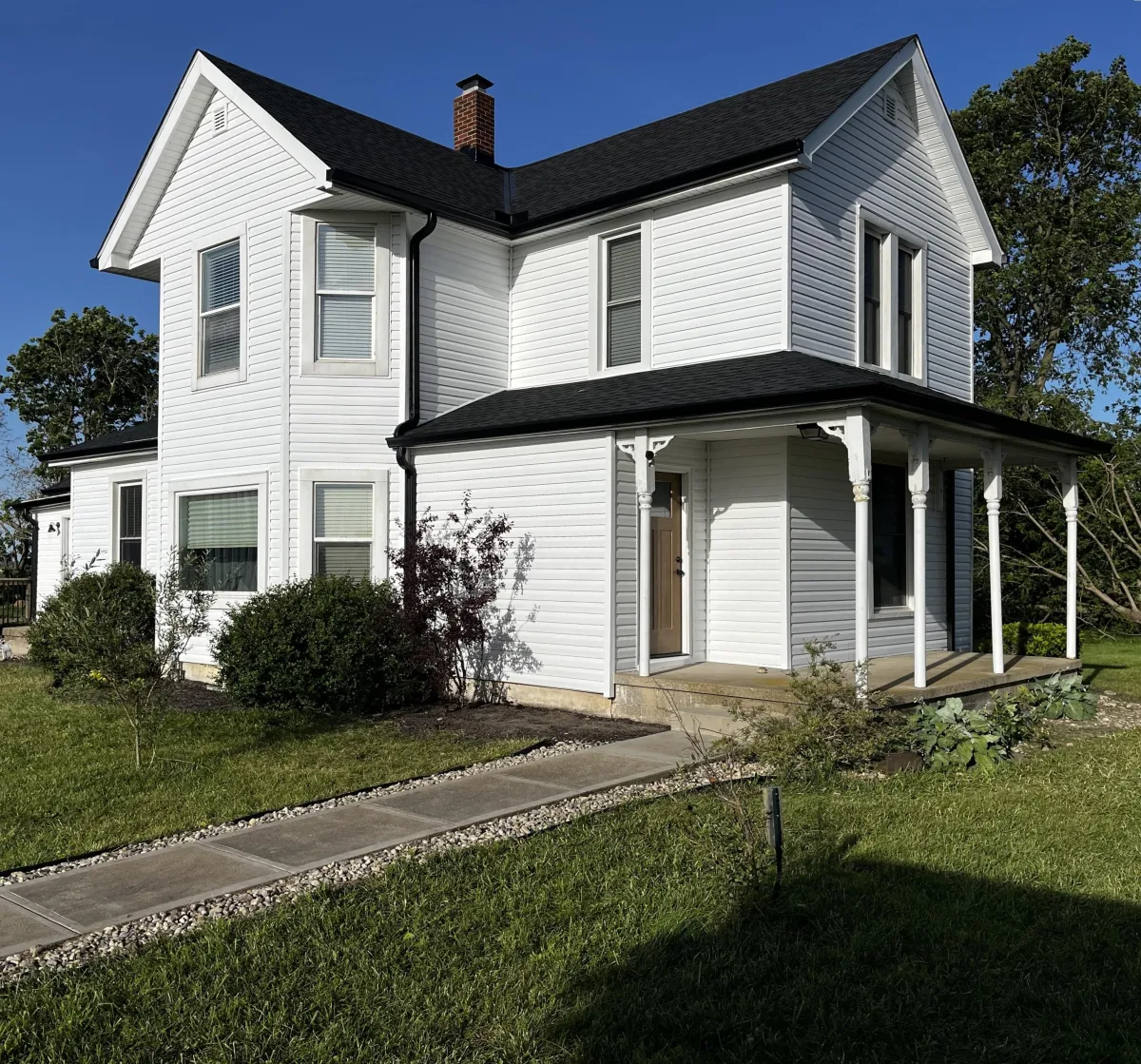 Black gutters on a white house in the greater cincinnati area