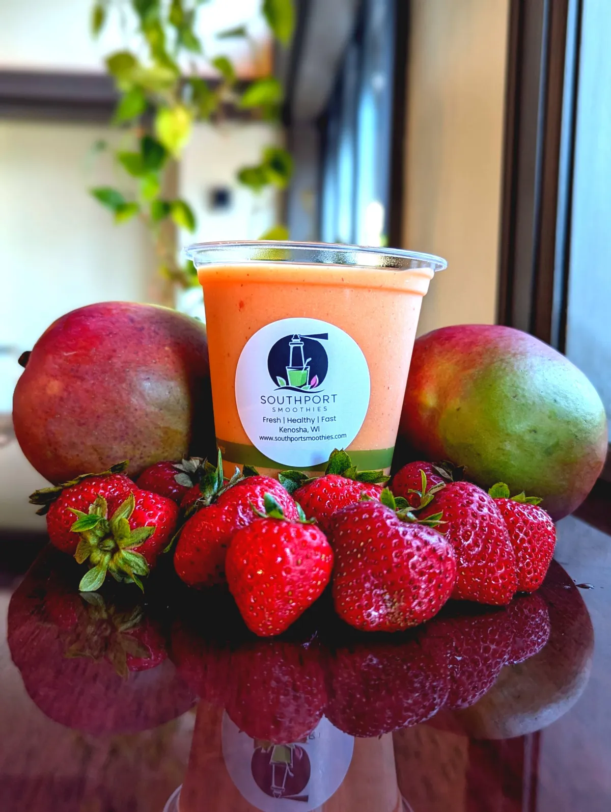 Smoothie made with real, fresh ingredients - mango, pinapple, strawberries, and oranges. dairy free gluten freen