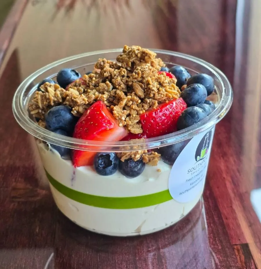 Yogurt parfait bowl made with gluten free granola and fresh fruit.