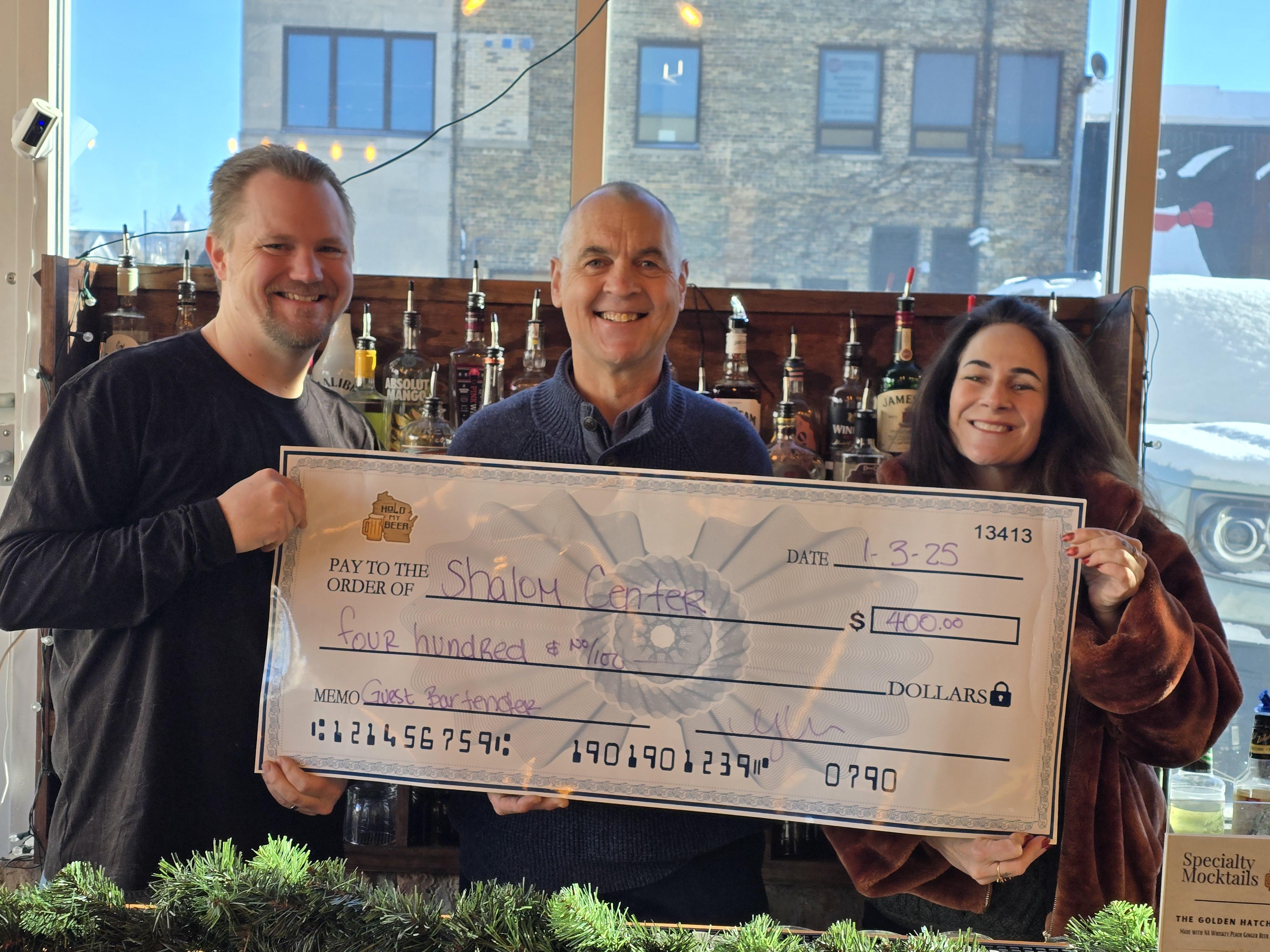 Guest bartender charity fundraiser at Hold My Beer Kenosha with local community members enjoying drinks and axe throwing