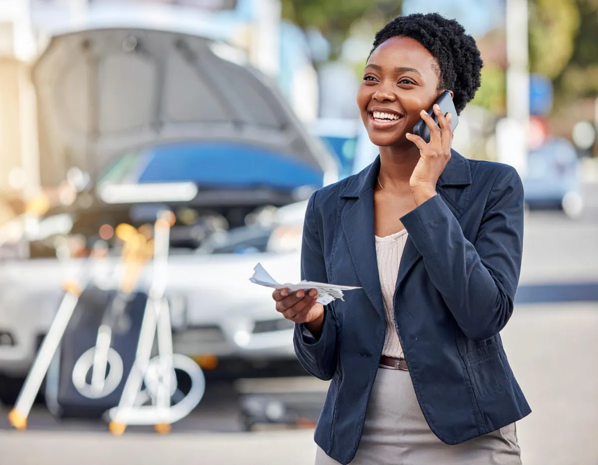 a couple of women sitting next to each other holding signs
