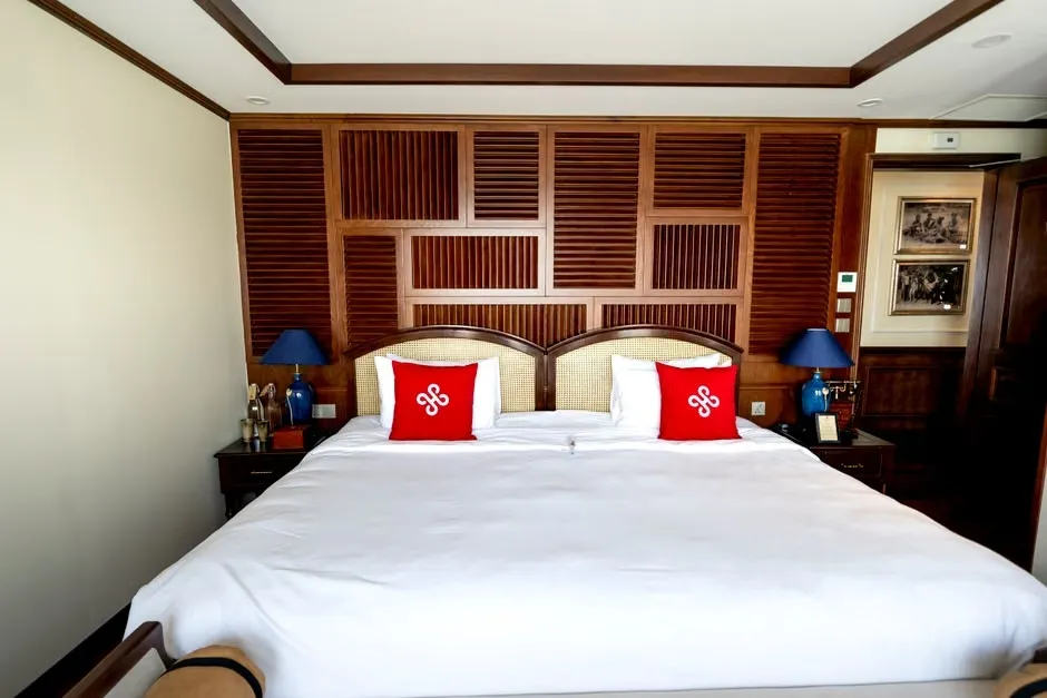 King-size bed in a spacious bedroom with wood accents