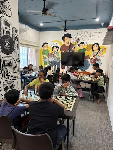 Chess students playing games during a coaching session at CHESS KLUB