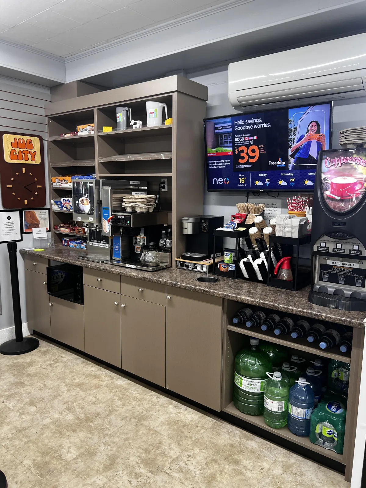 woman in brown long sleeve shirt and gray pants standing in front of white counter
