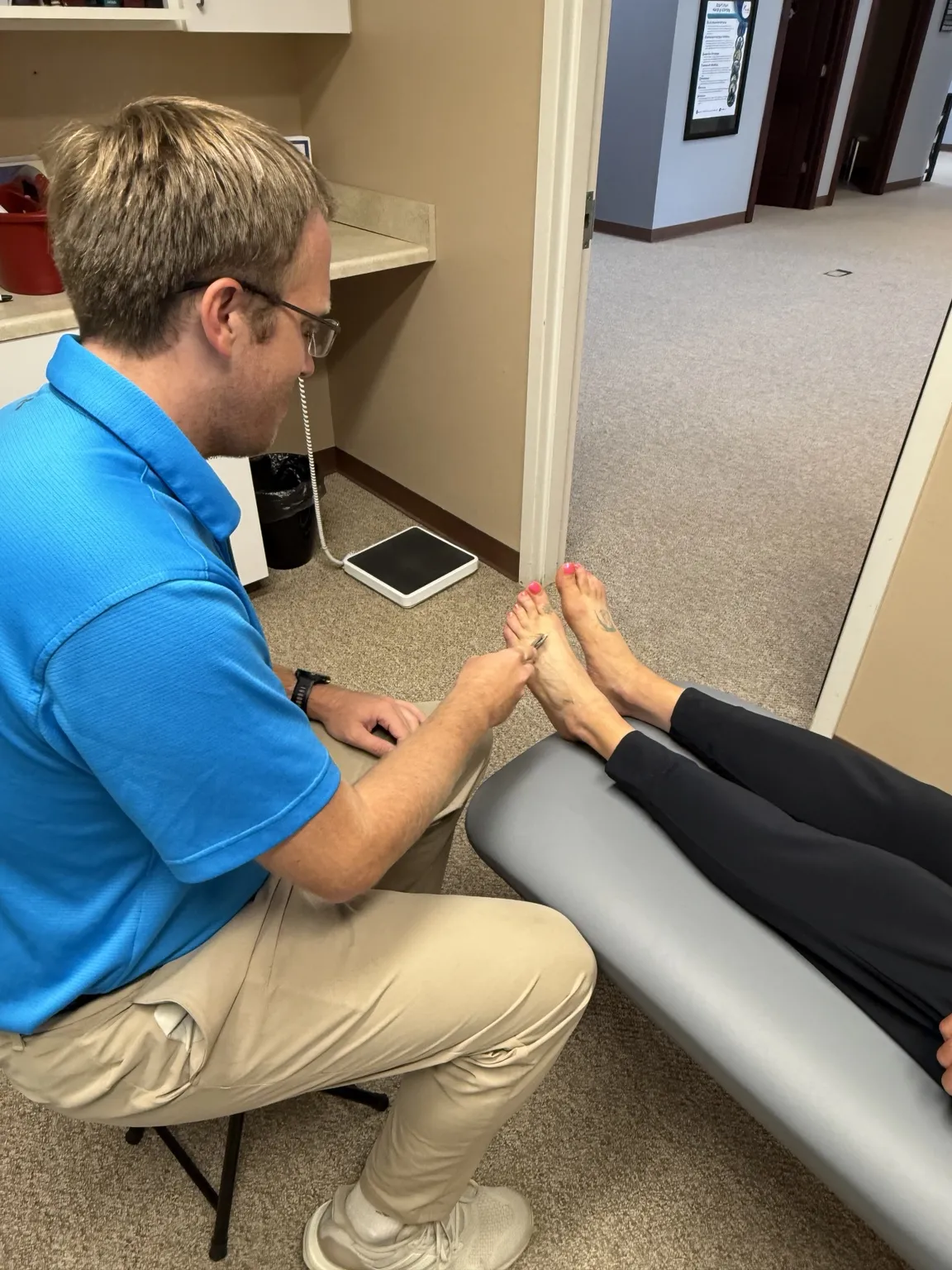 Empathetic clinician holding an in-depth consultation with a patient discussing nerve symptoms in a welcoming medical office