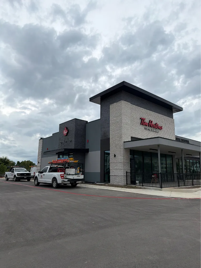 Photo needed. A finished tenant build-out that 4B wired, such as an office or retail interior with the new lighting on.