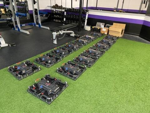 man in brown shirt playing arcade game