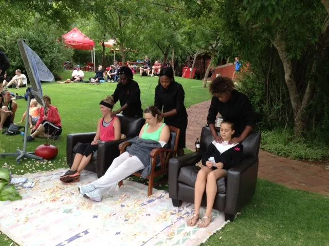 a large indoor swimming pool with a view of the trees