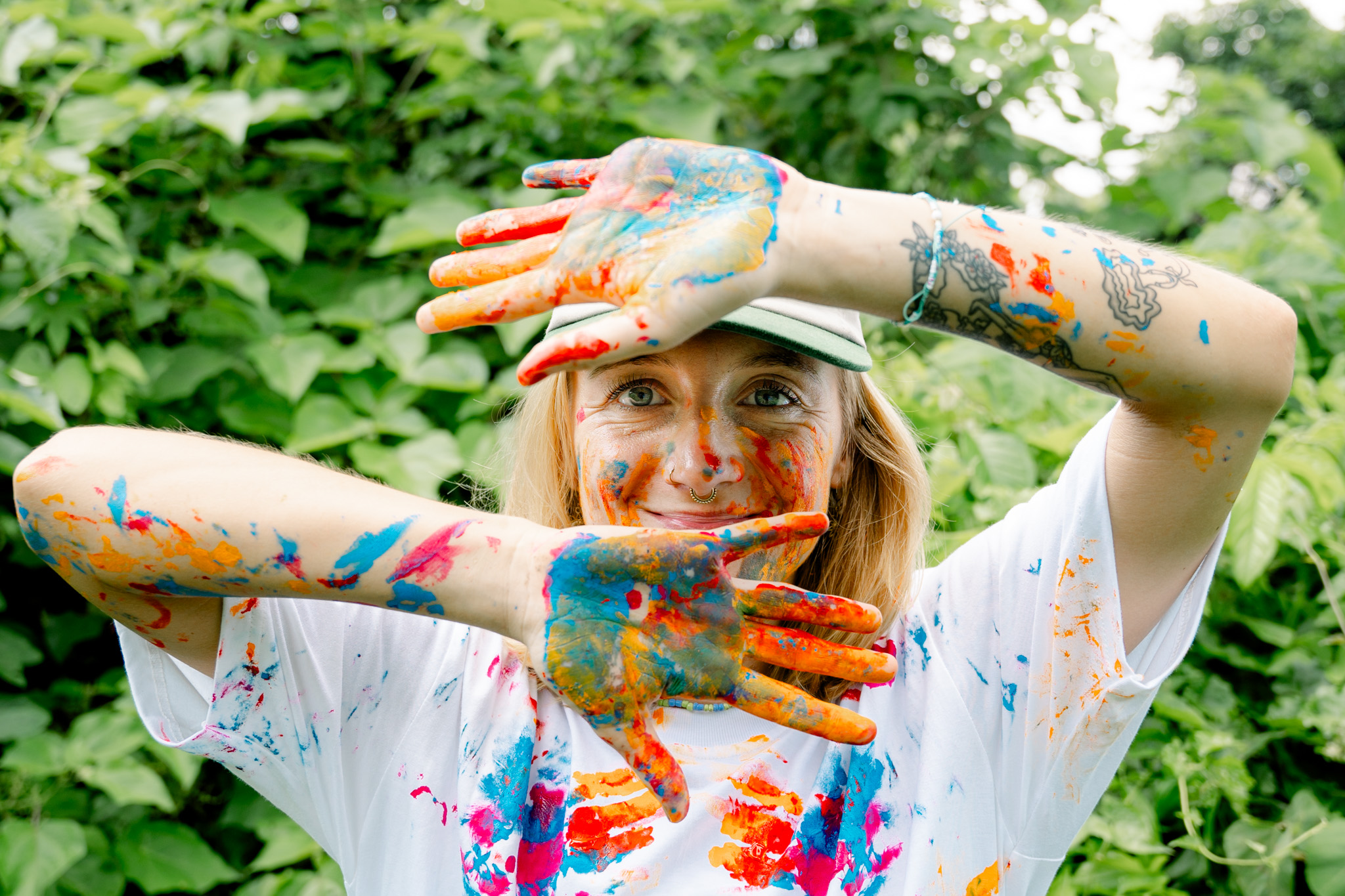 Playful illustration of the artist surrounded by colorful shapes