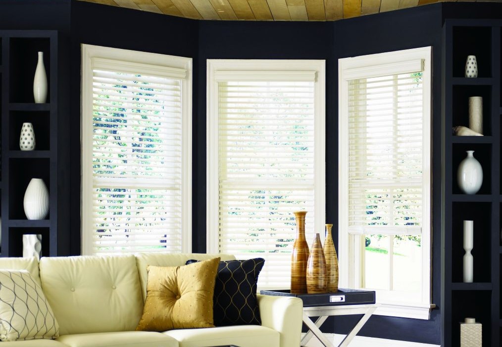 Classic horizontal faux wood blinds in a sunlit room