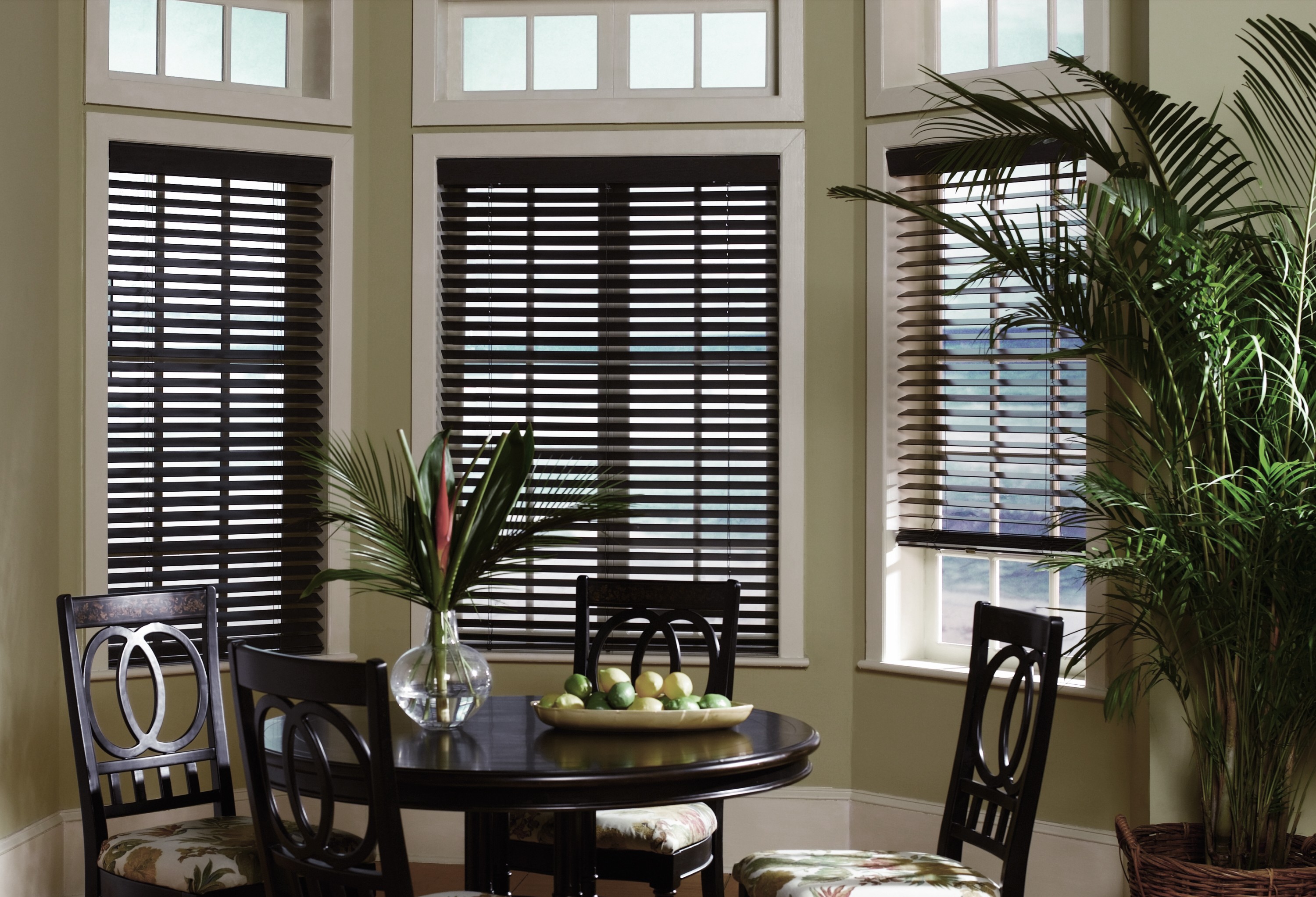 Classic horizontal faux wood blinds in a sunlit room