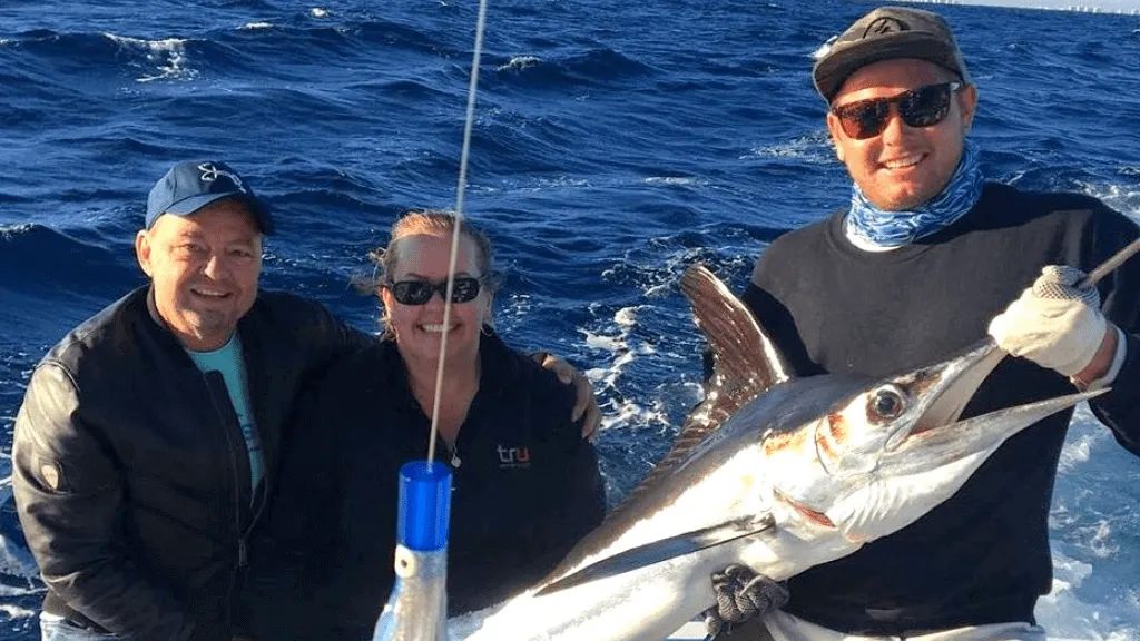 Trophy Sailfish caught by happy clients out on the ocean aboard Killin Time Charter