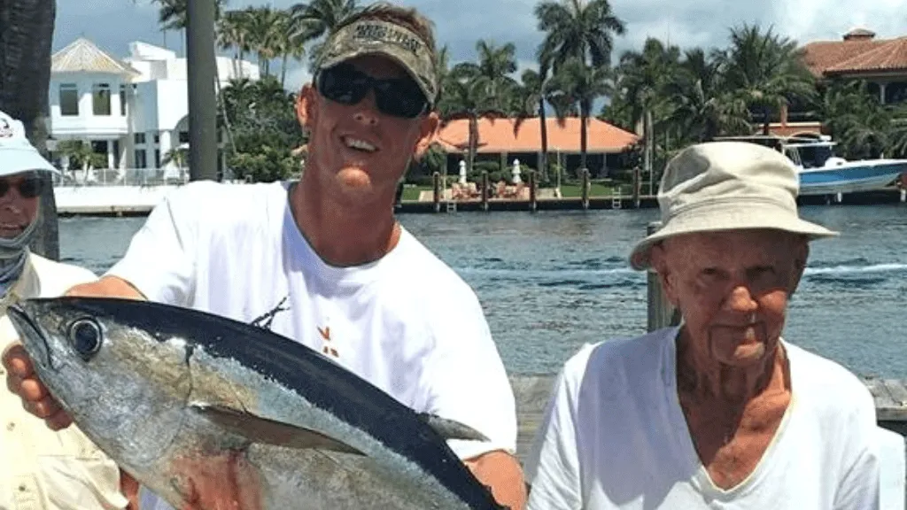 Anglers holding a fresh Tuna catch on a family fishing charter in Pompano Beach