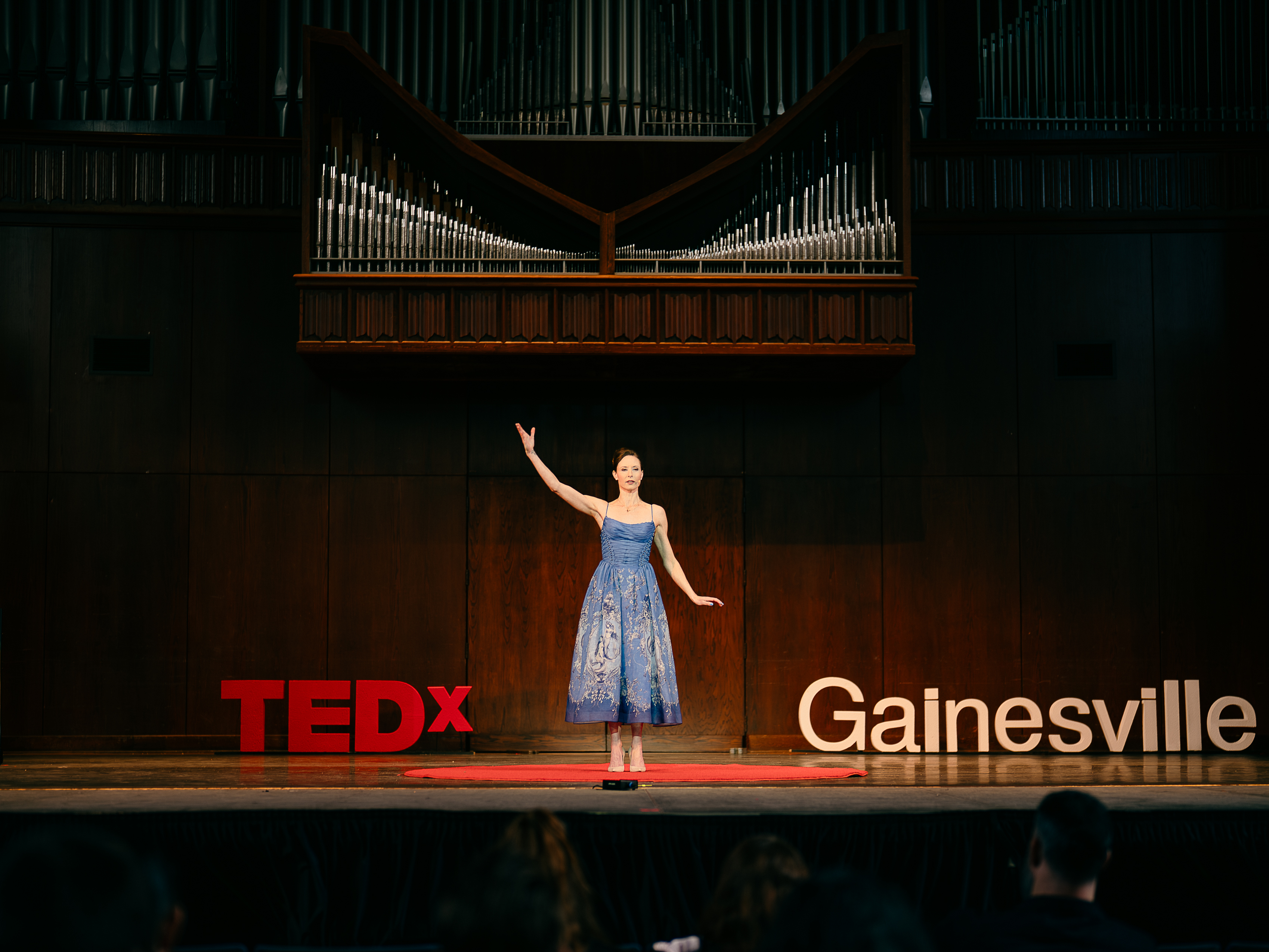 A woman looking at herself in the mirror